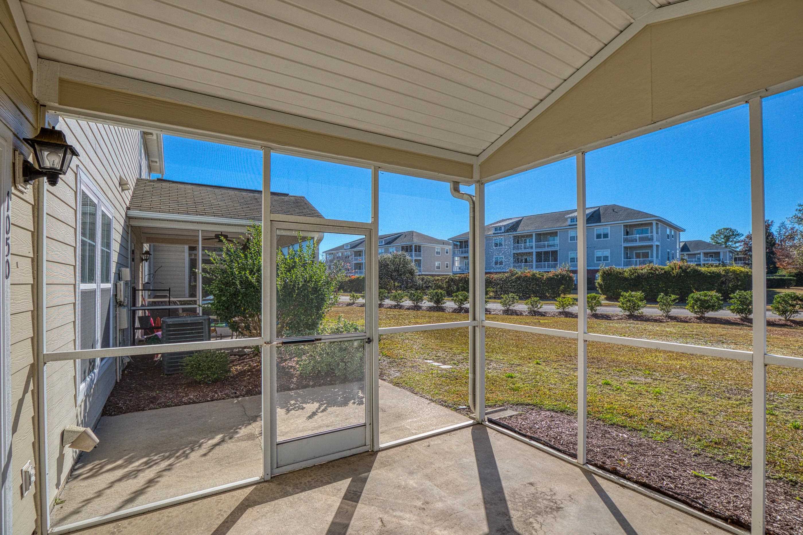 205 Threshing Way, Unit 1050 Myrtle Beach, SC 29579 - Photo 35 of 40 Unfurnished sunroom with lofted ceiling