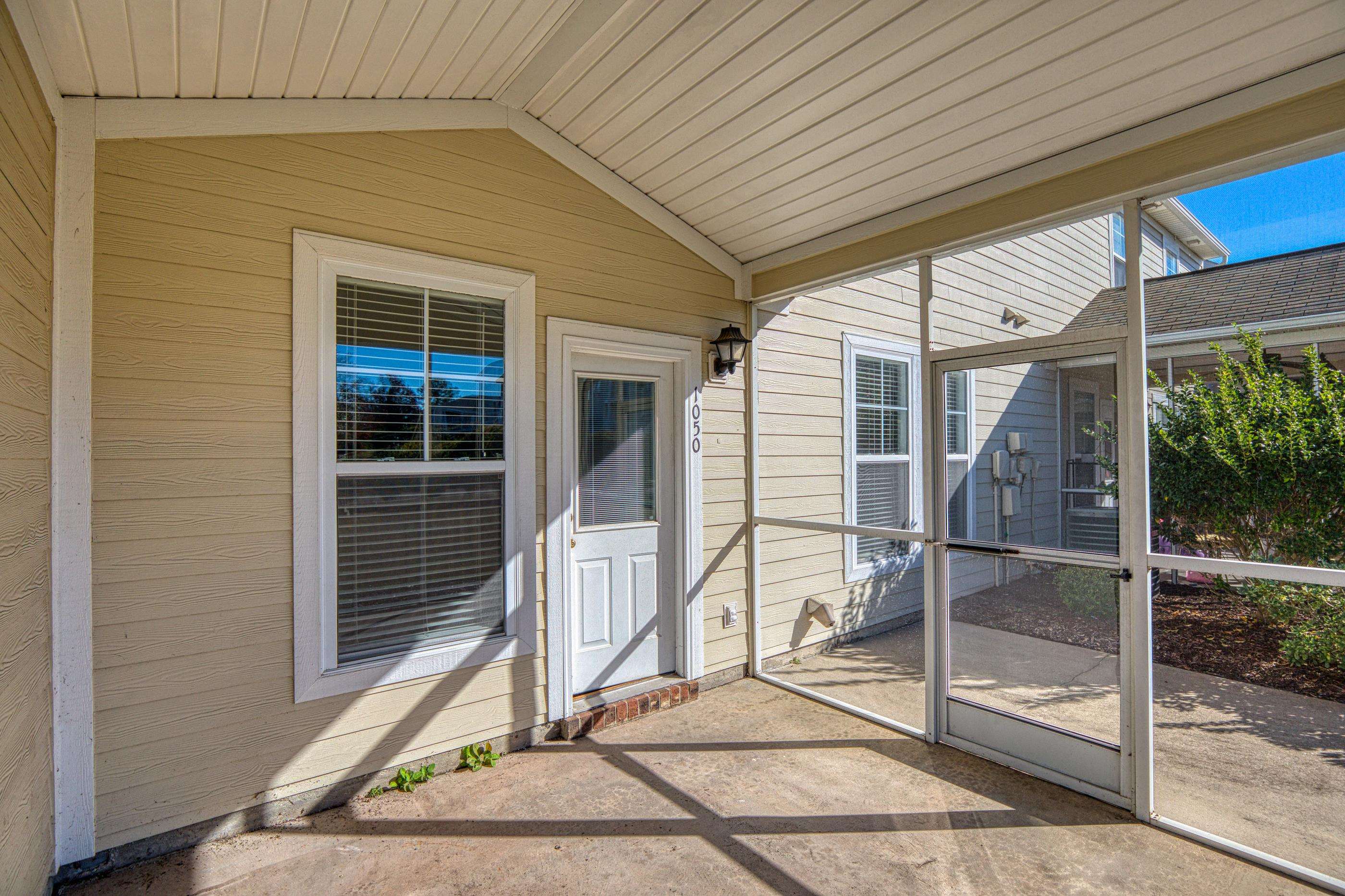 205 Threshing Way, Unit 1050 Myrtle Beach, SC 29579 - Photo 36 of 40 Unfurnished sunroom with vaulted ceiling