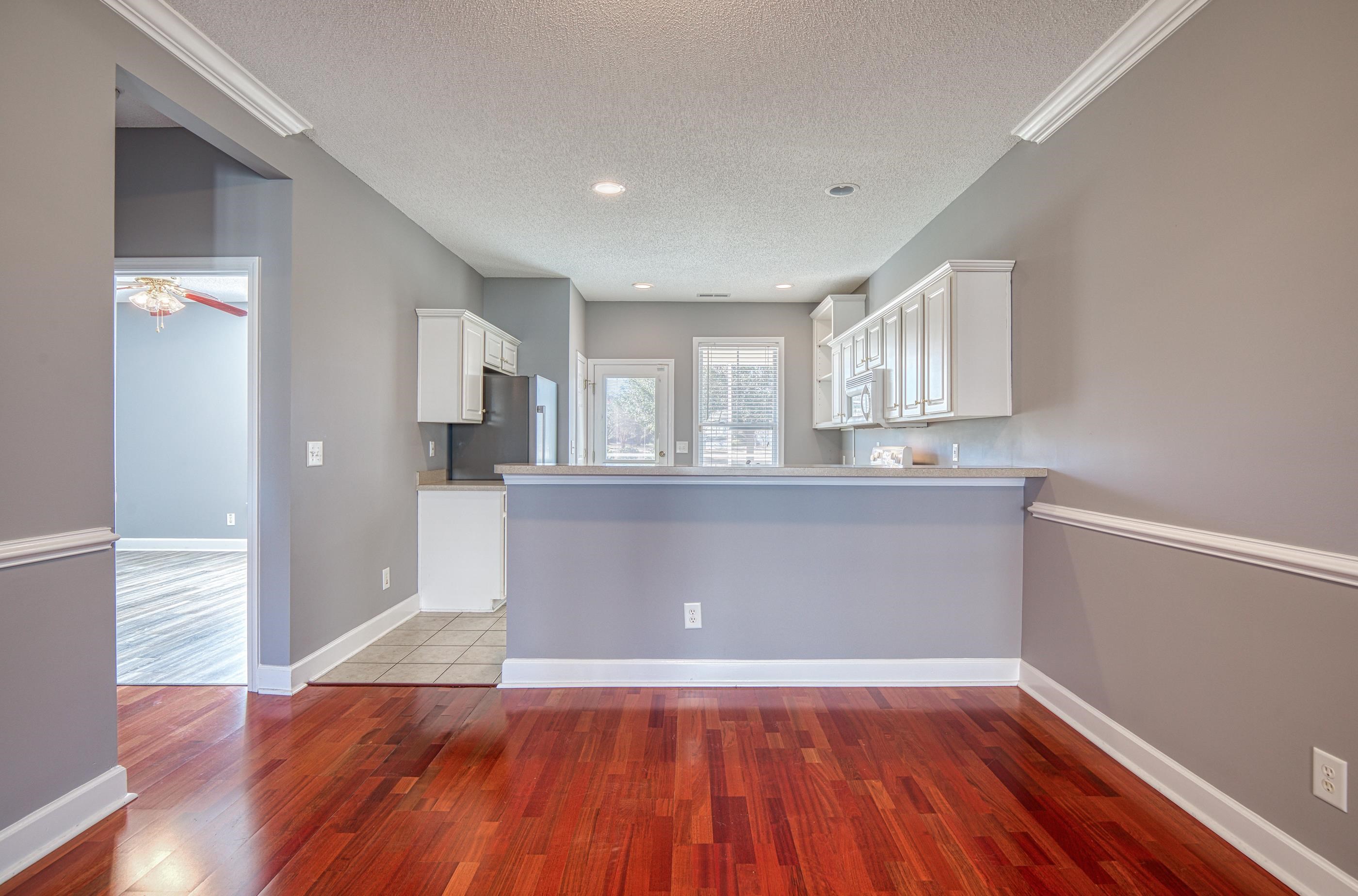 205 Threshing Way, Unit 1050 Myrtle Beach, SC 29579 - Photo 8 of 40 Kitchen with white cabinets, dark wood-style floors, light countertops, a textured ceiling, and recessed lighting