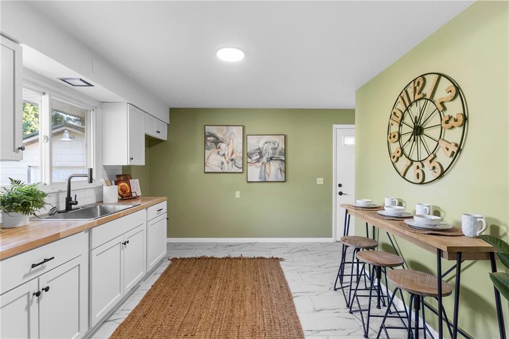 2085 Debrakeleer Avenue Farrell, PA 16121 - Photo 8 of 17 a view of a room with workspace and wooden floor