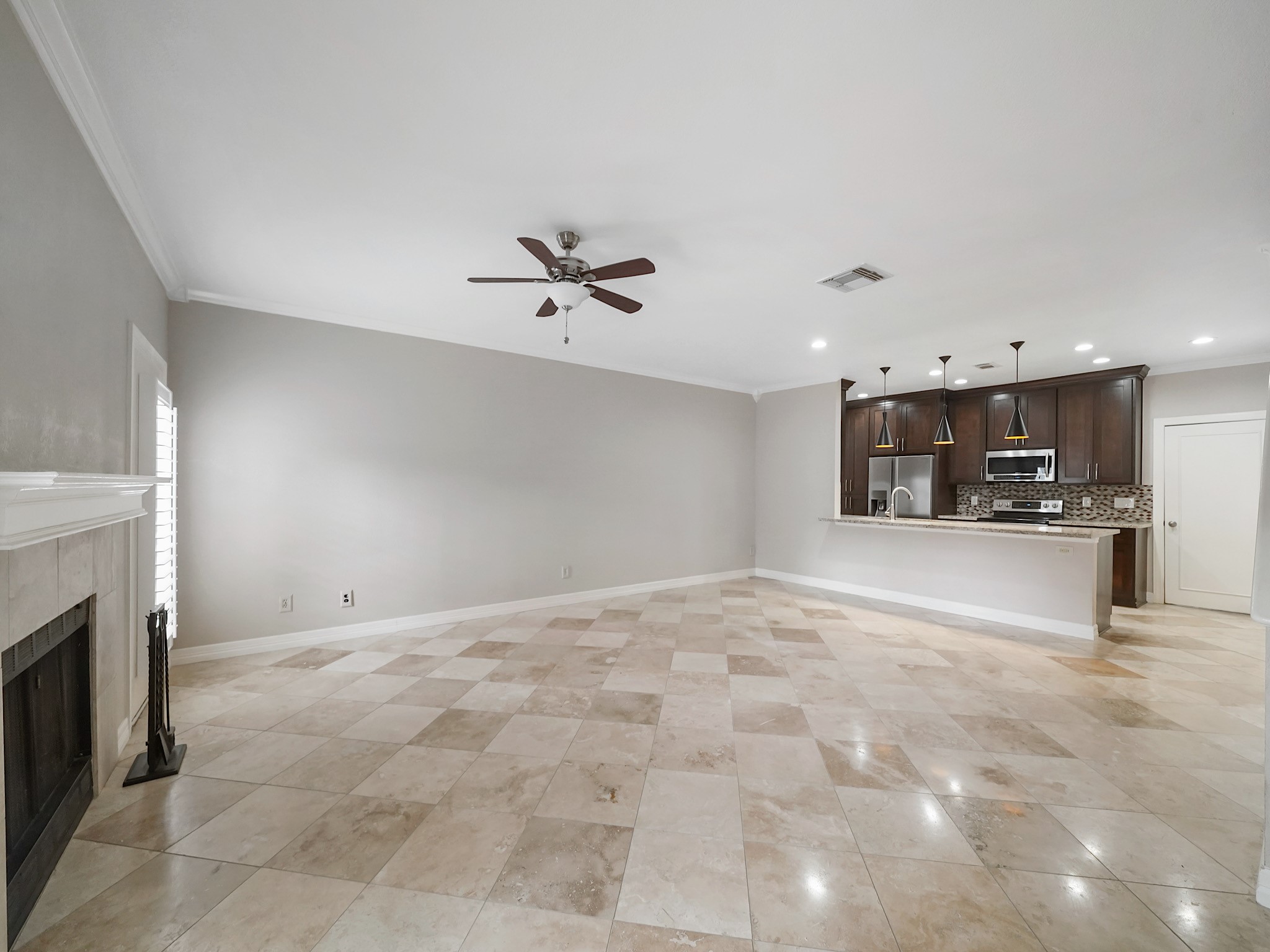 6000 Reims Road, Unit 2205 Houston, TX 77036 - Photo 5 of 35 Refined living and dining area designed for effortless entertaining.