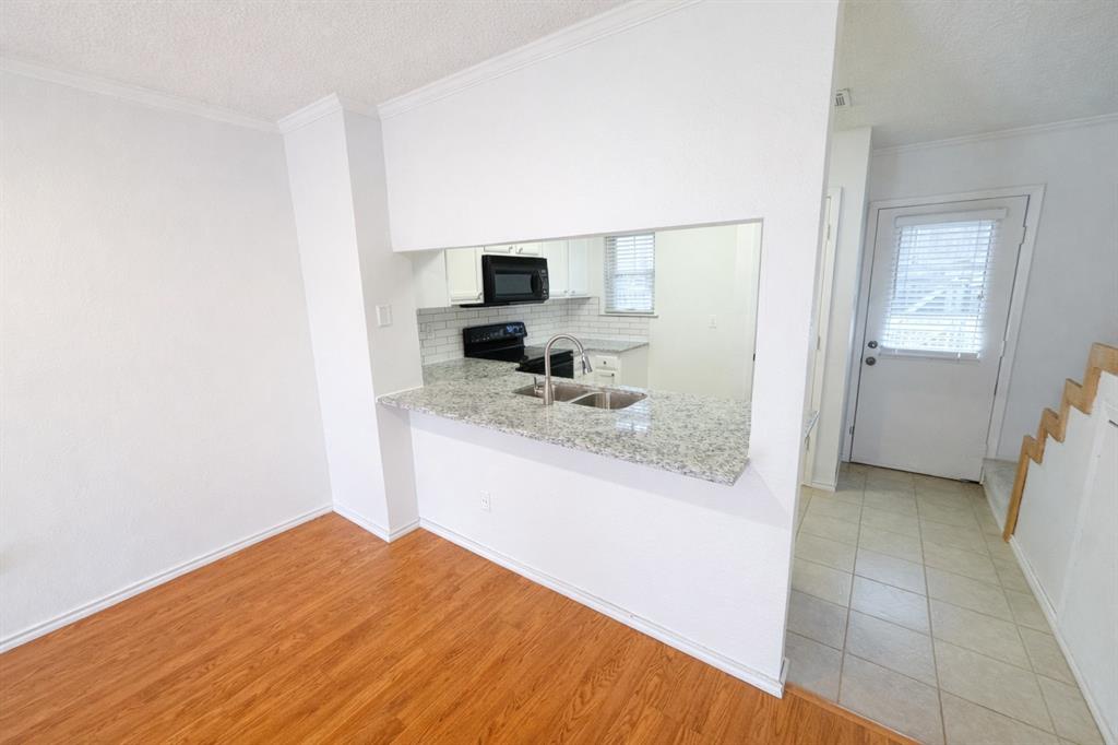 17 Abbey Road Euless, TX 76039 - Photo 12 of 23 View of the newly remodeled kitchen with space for stools.