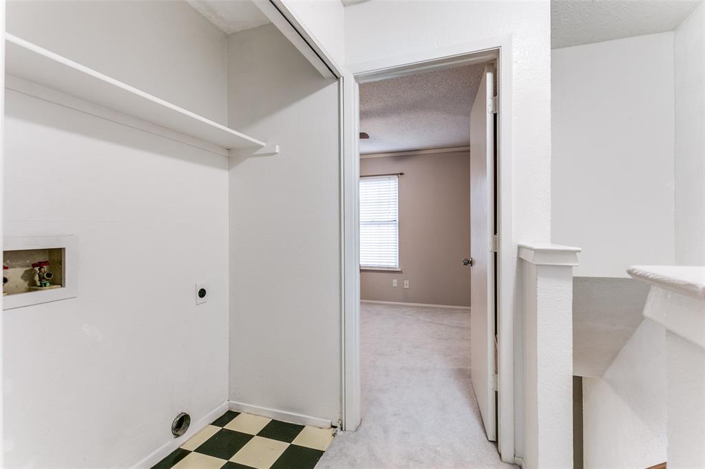 17 Abbey Road Euless, TX 76039 - Photo 18 of 23 Laundry area between bedrooms upstairs.