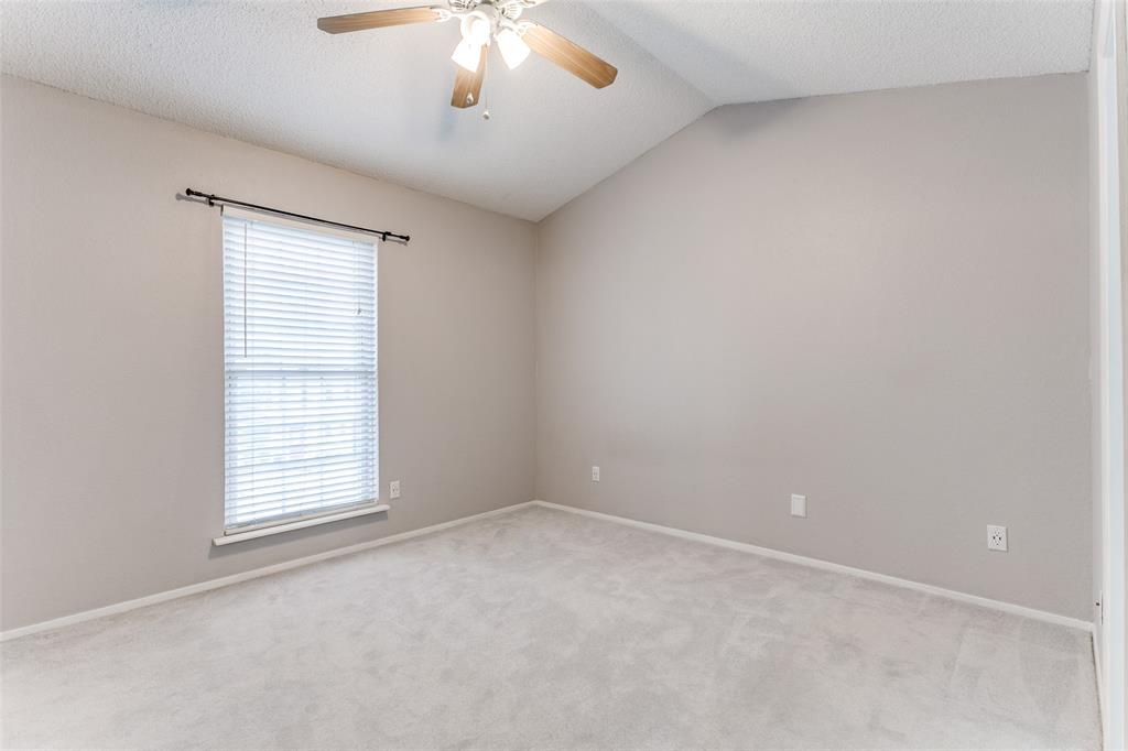 17 Abbey Road Euless, TX 76039 - Photo 5 of 23 Large primary bedroom space with ceiling fan and carpet
