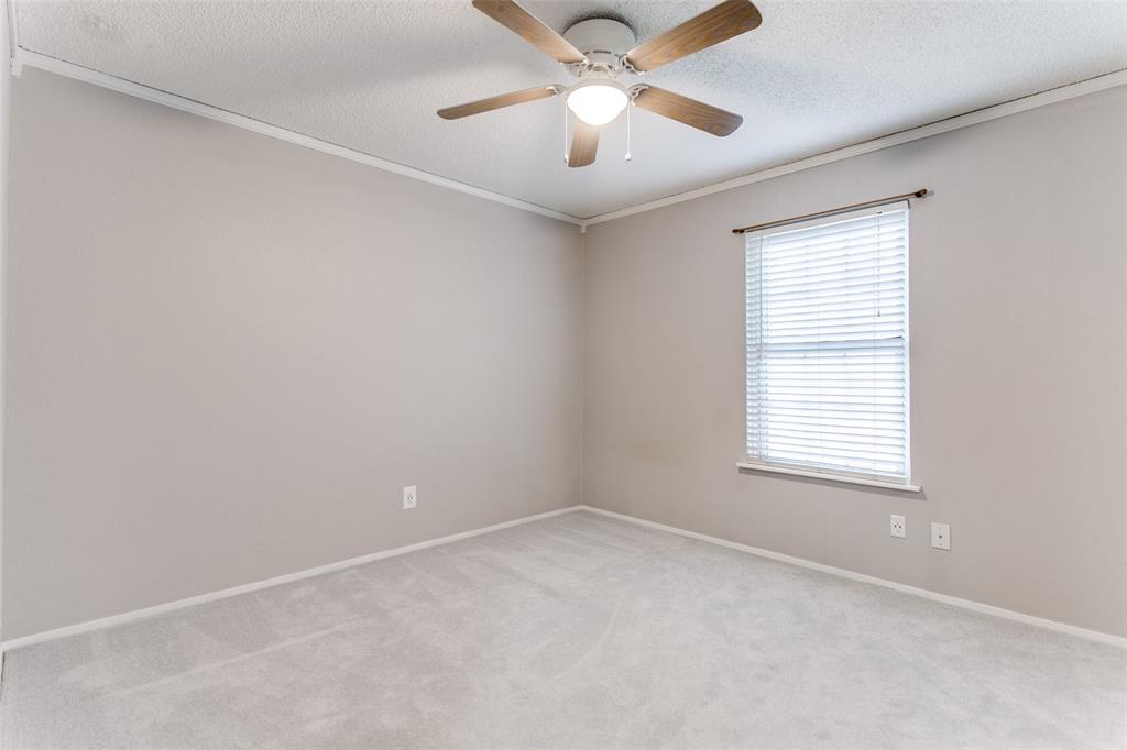 17 Abbey Road Euless, TX 76039 - Photo 7 of 23 Second bedroom with ceiling fan and carpet