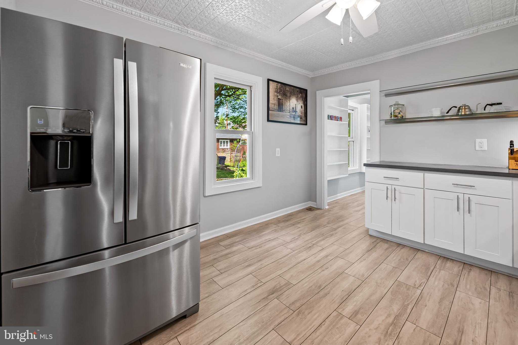 4605 Schenley Road Baltimore, MD 21210 - Photo 15 of 44 a kitchen with stainless steel appliances granite countertop a refrigerator and a sink