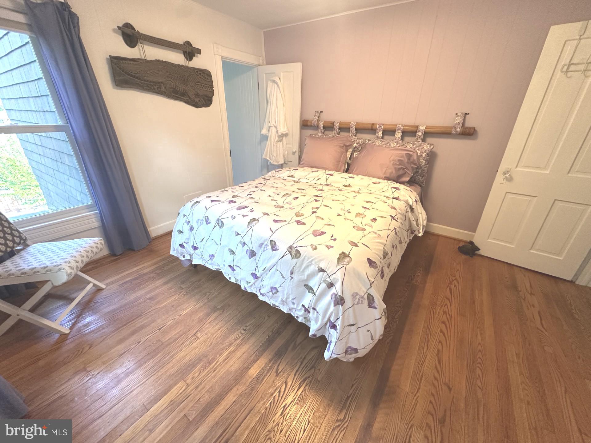 4605 Schenley Road Baltimore, MD 21210 - Photo 22 of 44 a bed sitting in a bedroom next to a window