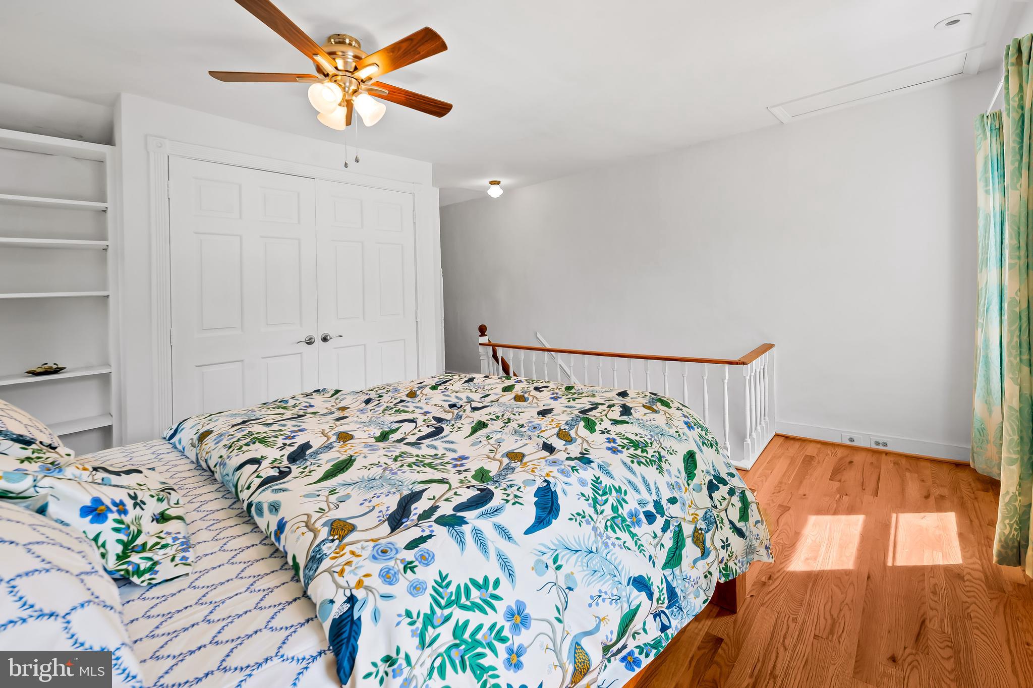 4605 Schenley Road Baltimore, MD 21210 - Photo 26 of 44 a bedroom with bed and a chandelier