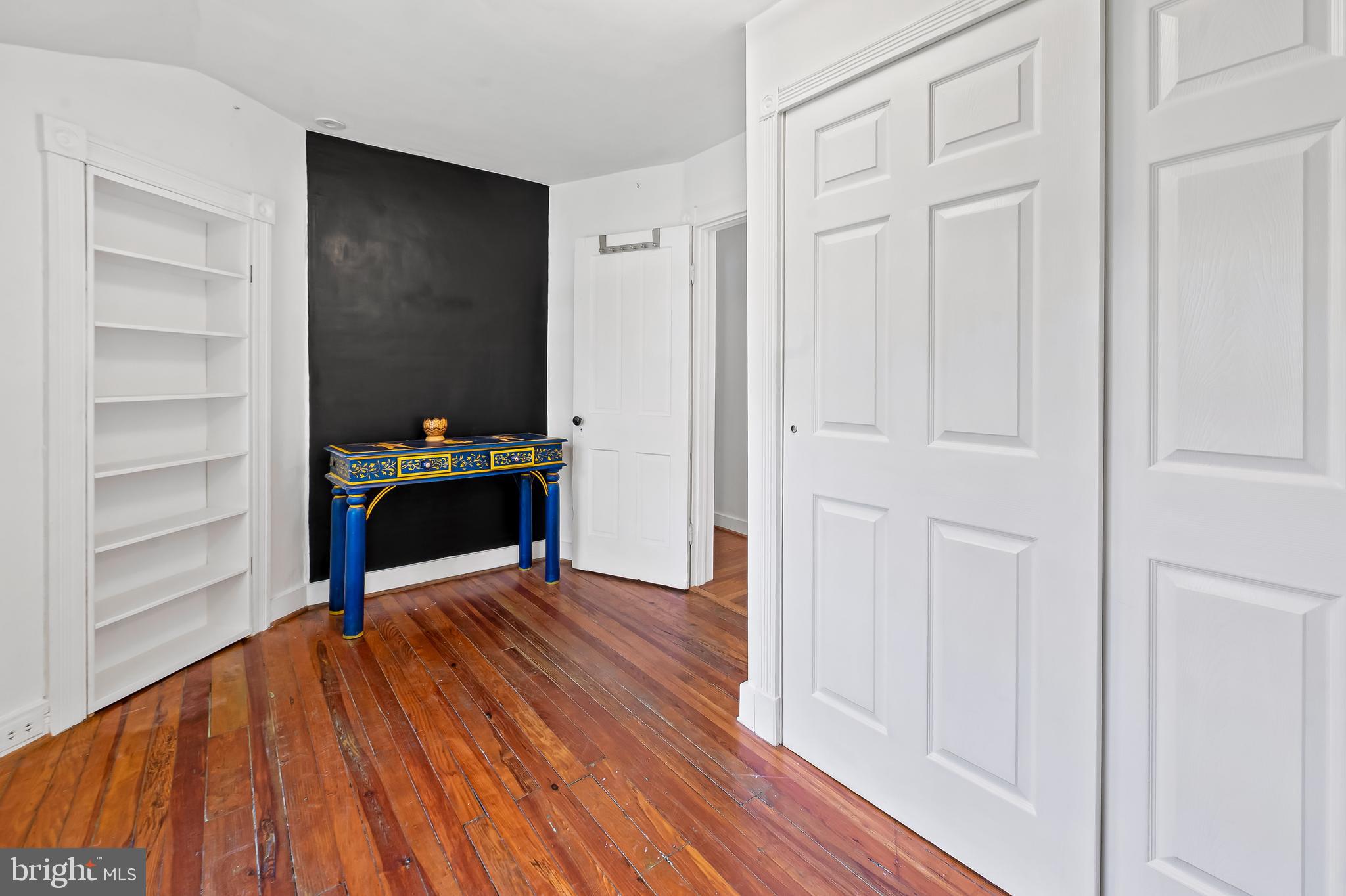 4605 Schenley Road Baltimore, MD 21210 - Photo 28 of 44 an empty room with wooden floor closet and windows