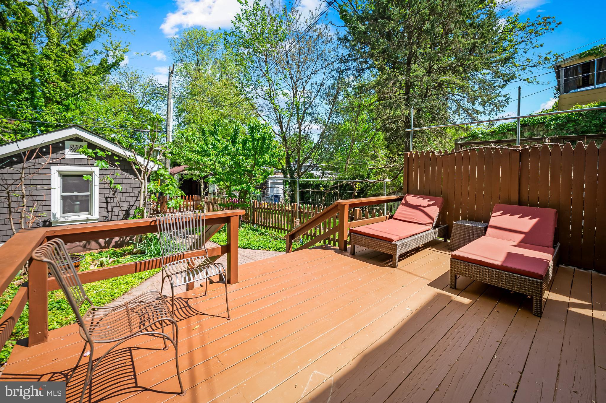 4605 Schenley Road Baltimore, MD 21210 - Photo 35 of 44 a view of a chairs and table in patio with wooden fence