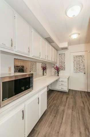 a utility room with sink dryer and washer