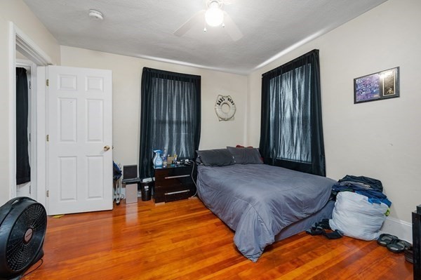 6 Rayner Street Blackstone, MA 01504 - Photo 11 of 33 a spacious bedroom with a bed and wooden floor