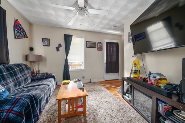 6 Rayner Street Blackstone, MA 01504 - Photo 14 of 33 a living room with furniture and a flat screen tv