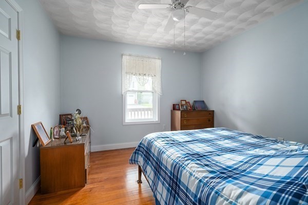 6 Rayner Street Blackstone, MA 01504 - Photo 17 of 33 a bedroom with a bed and wooden floor