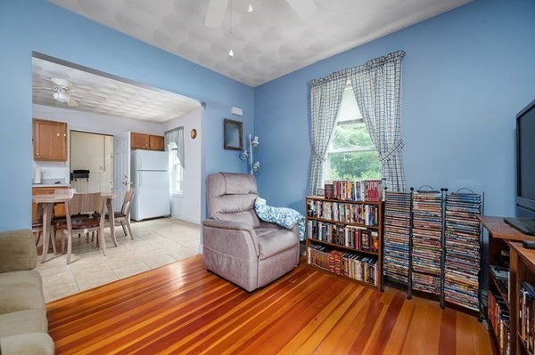 6 Rayner Street Blackstone, MA 01504 - Photo 21 of 33 a living room with furniture a rug and a floor to ceiling window