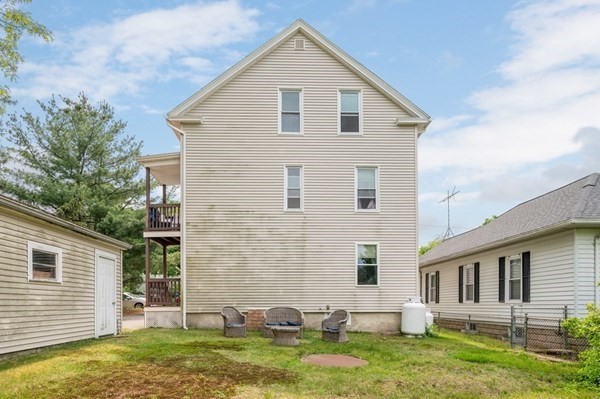 6 Rayner Street Blackstone, MA 01504 - Photo 30 of 33 a view of a yard in front of a house with plants and large tree