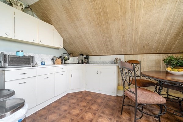 6 Rayner Street Blackstone, MA 01504 - Photo 4 of 33 a kitchen with a white cabinets and chairs