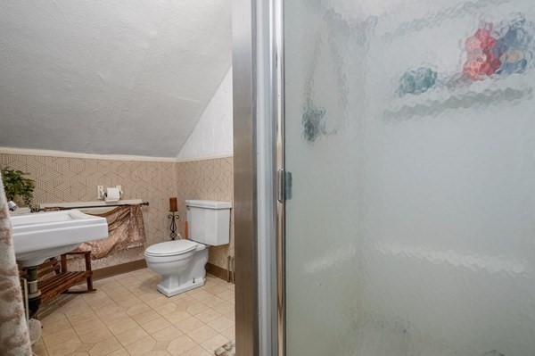 6 Rayner Street Blackstone, MA 01504 - Photo 5 of 33 a bathroom with a toilet and a sink