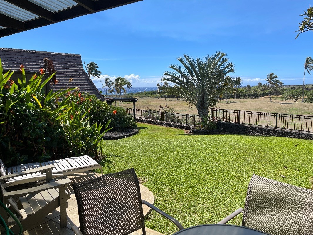 95-788 Ninole Loop Road, Unit 41 Naalehu, HI 96772 - Photo 2 of 19 a view of a backyard with plants