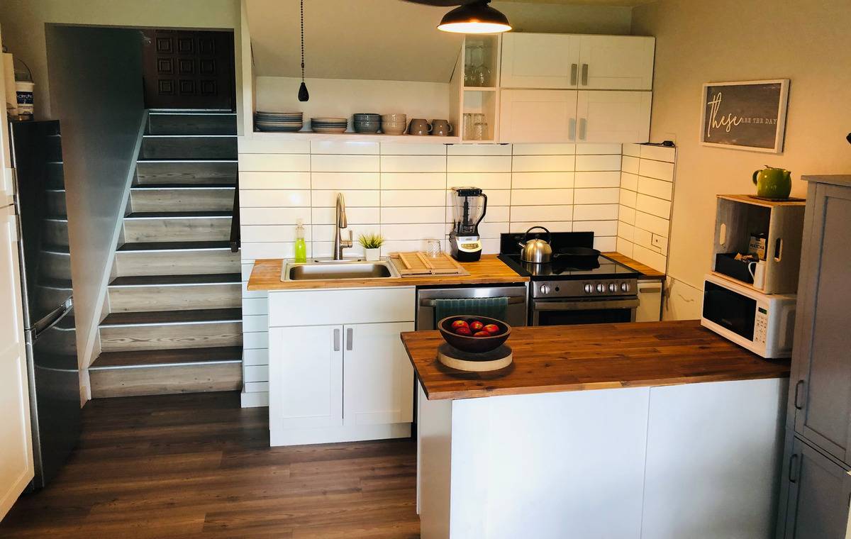 95-788 Ninole Loop Road, Unit 41 Naalehu, HI 96772 - Photo 5 of 19 a utility room with stainless steel appliances and cabinets
