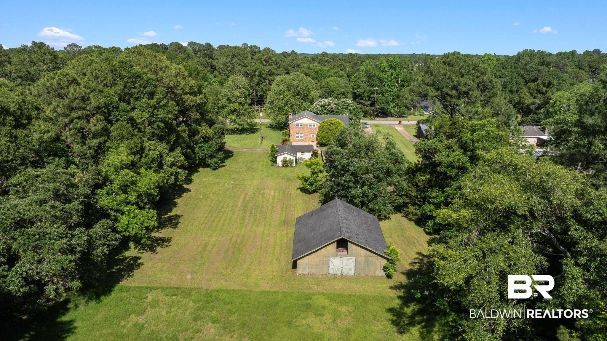 950 Walter Smith Road Mobile, AL 36695 - Photo 38 of 51 View from above of property with a forest