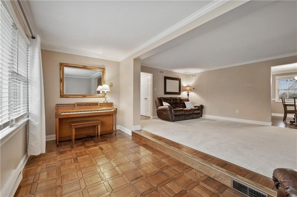 1787 Hassam Road Coraopolis, PA 15108 - Photo 13 of 28 The sitting room includes hardwood floors and crown molding.