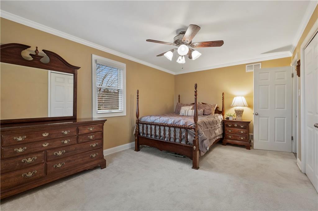 1787 Hassam Road Coraopolis, PA 15108 - Photo 16 of 28 The primary includes a large closet and neutral décor.