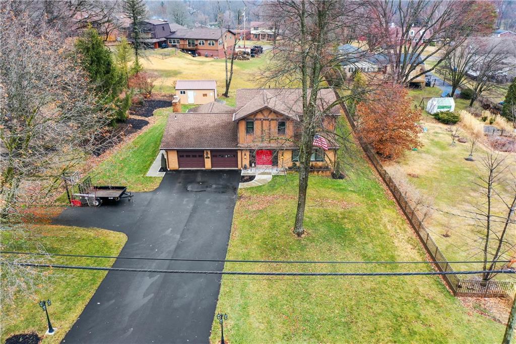 1787 Hassam Road Coraopolis, PA 15108 - Photo 2 of 28 The home sits on a half an acre lot and offers an extra large driveway.