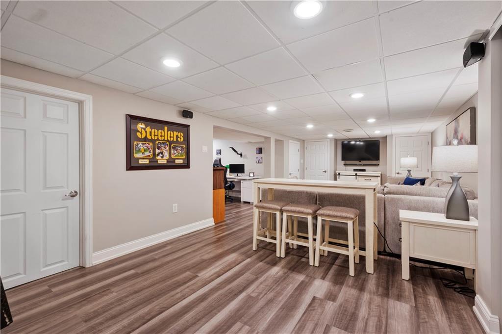 1787 Hassam Road Coraopolis, PA 15108 - Photo 22 of 28 The finished basement has laminate flooring and recessed lighting. It's great place to relax!