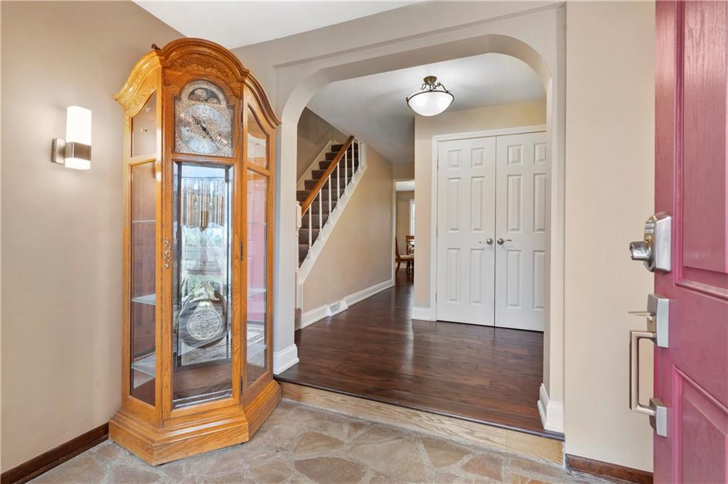 1787 Hassam Road Coraopolis, PA 15108 - Photo 3 of 28 The entry is accented with a sunken stone floor and hardwood floors.