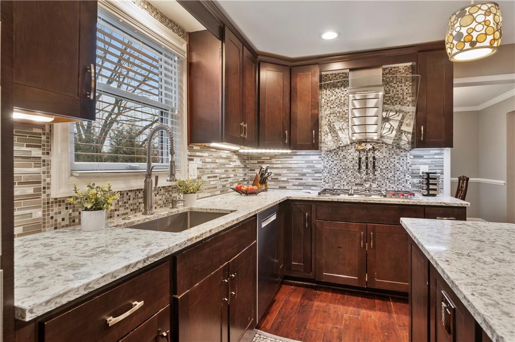 1787 Hassam Road Coraopolis, PA 15108 - Photo 5 of 28 A tile backsplash and under cabinet lighting provide the perfect accents.