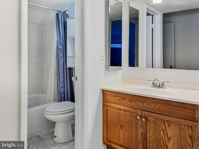 a bathroom with a toilet and a bathtub