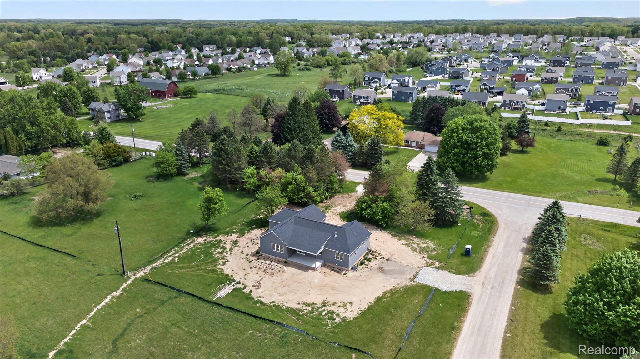 3297 Oak Grove Road Howell, MI 48855 - Photo 35 of 40 Expansive aerial perspective highlighting the surrounding area and neighborhood.