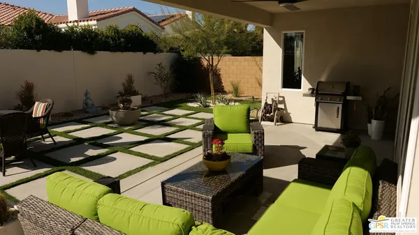 a patio with patio couch and table
