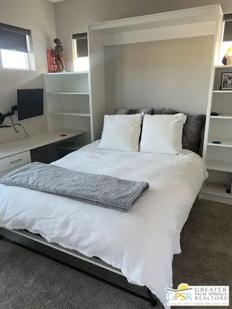 a bedroom with a bed and window