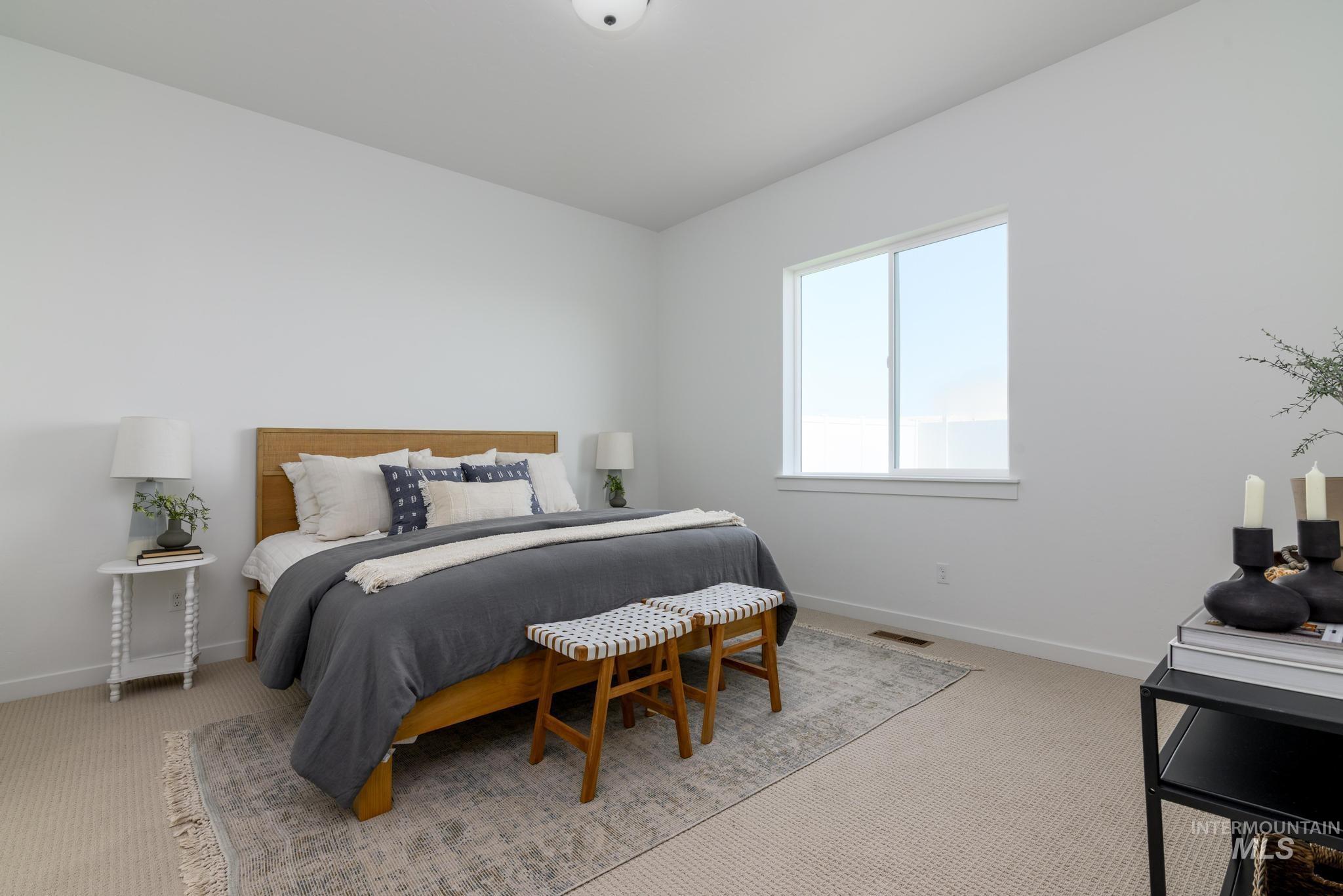 15086 Steel Cloud Avenue Caldwell, ID 83607 - Photo 21 of 41 Carpeted bedroom with baseboards