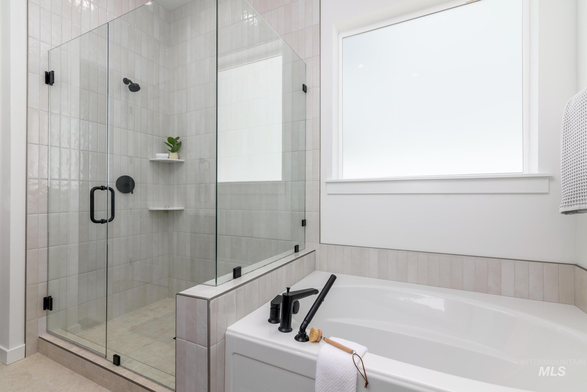 15086 Steel Cloud Avenue Caldwell, ID 83607 - Photo 23 of 41 Bathroom featuring a garden tub and a stall shower