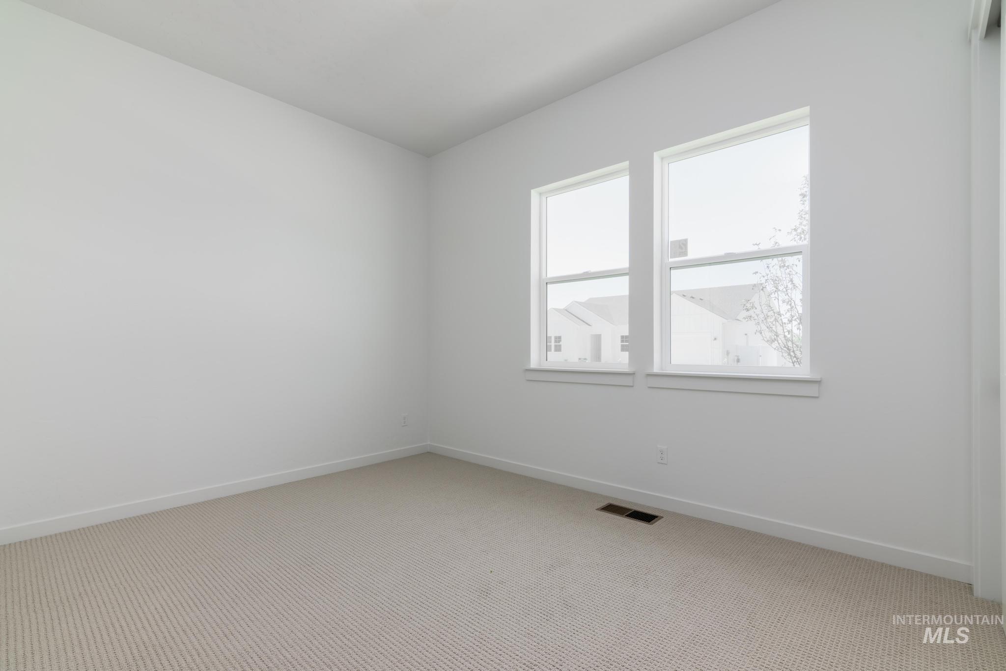 15086 Steel Cloud Avenue Caldwell, ID 83607 - Photo 24 of 41 Unfurnished room featuring light colored carpet and baseboards