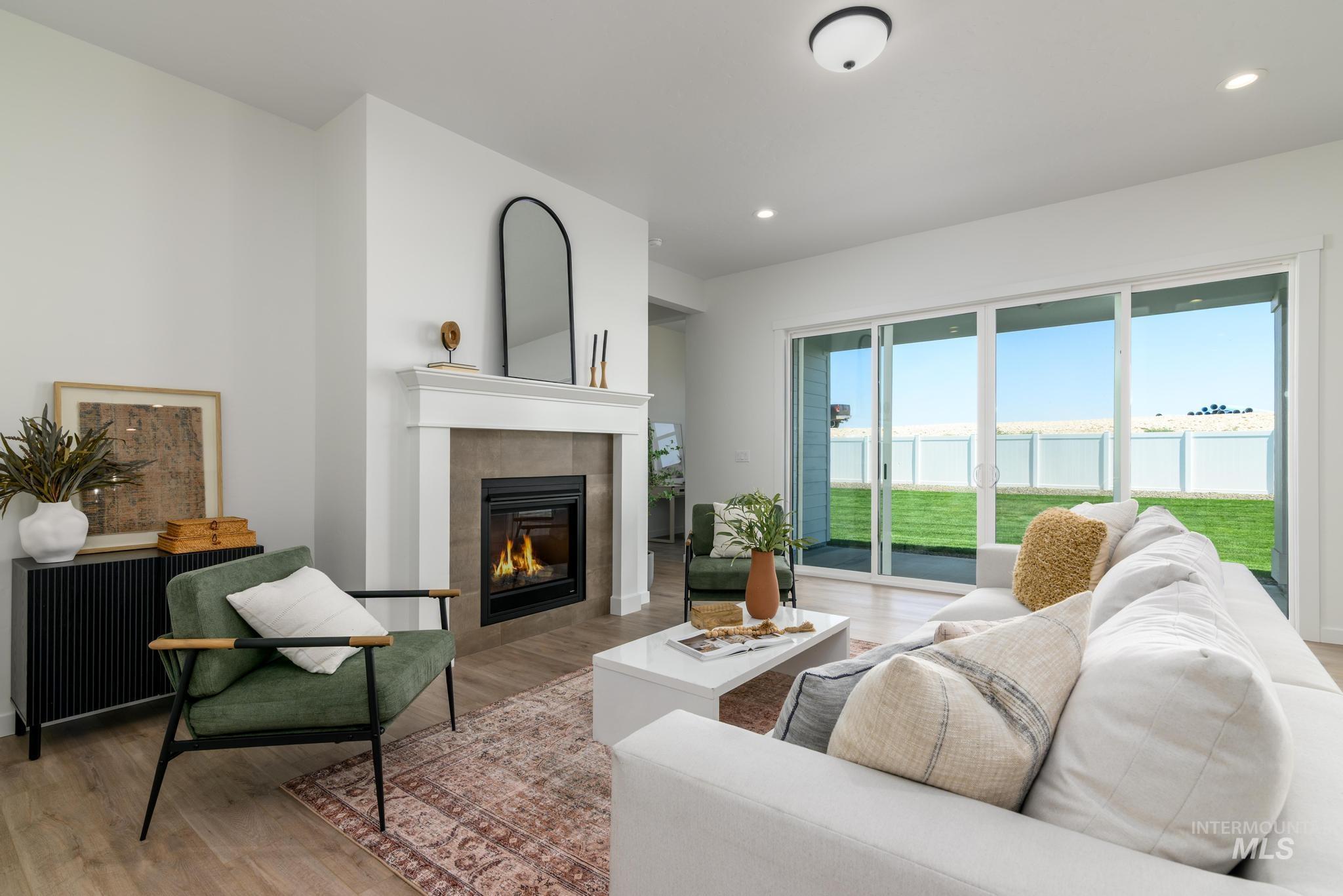 15086 Steel Cloud Avenue Caldwell, ID 83607 - Photo 5 of 41 Living area with light wood-style flooring, a fireplace, and recessed lighting