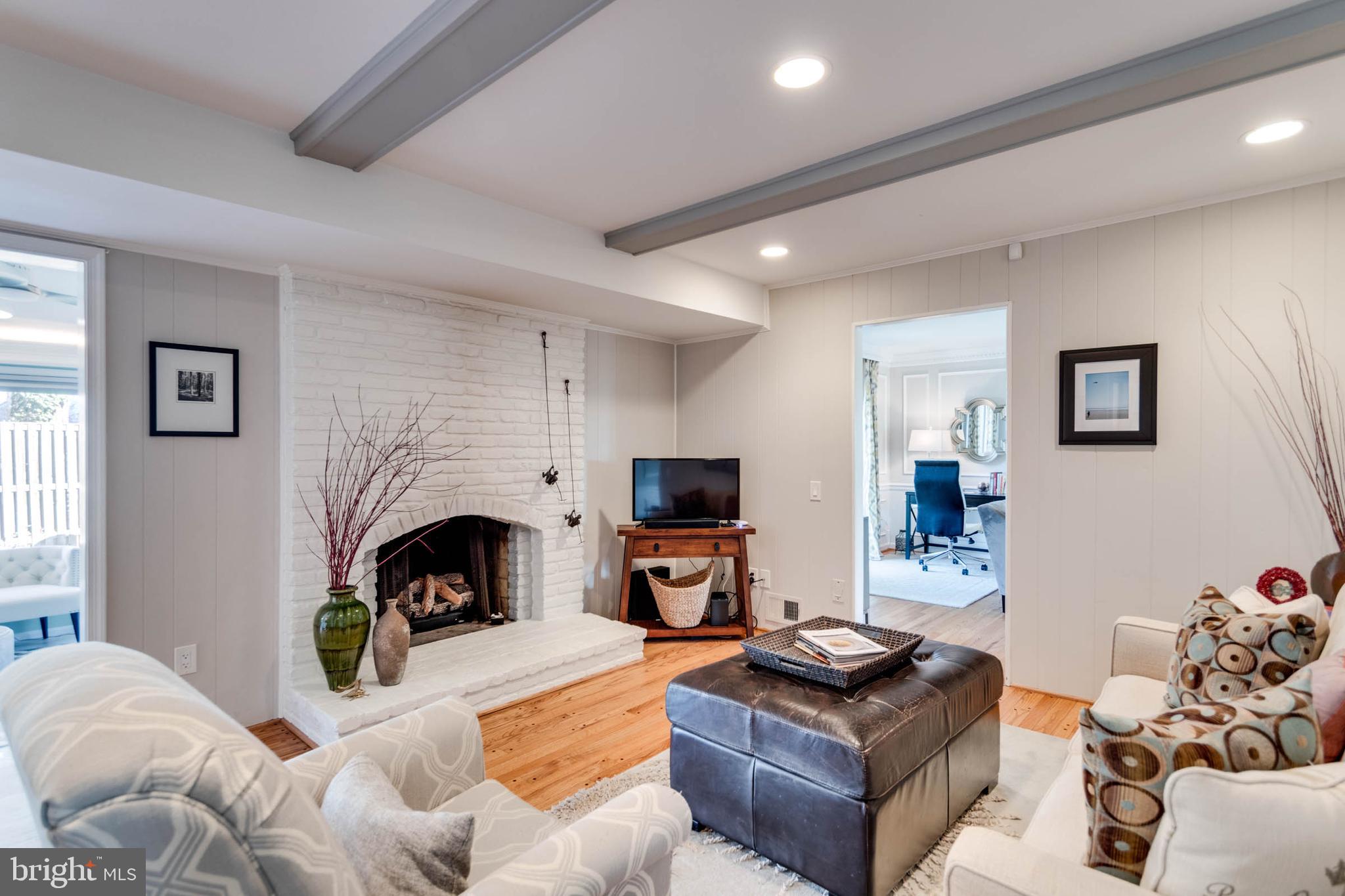 1007 St Stephens Road Alexandria, VA 22304 - Photo 23 of 59 a living room with furniture flat screen tv and a fireplace