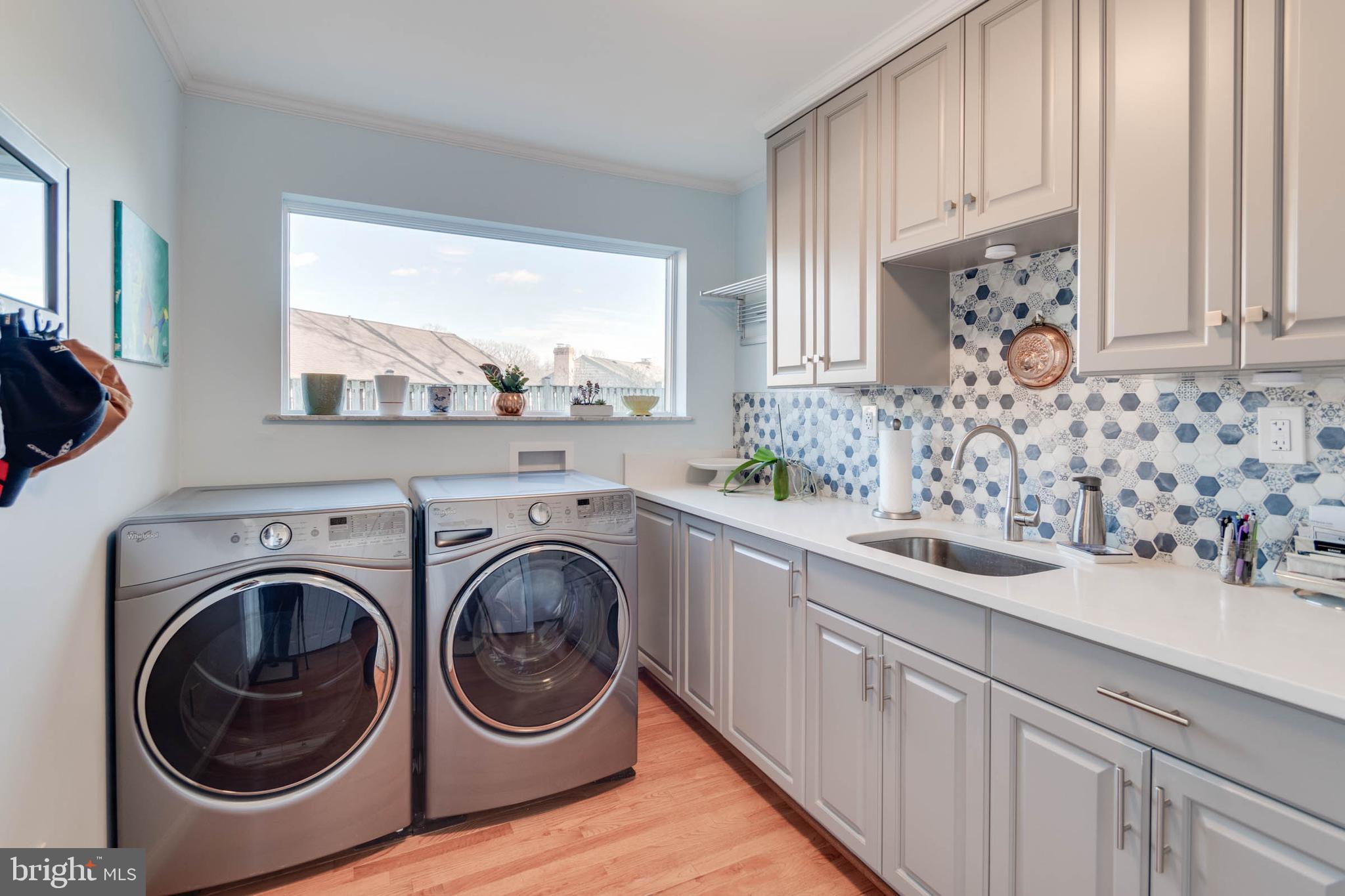 1007 St Stephens Road Alexandria, VA 22304 - Photo 32 of 59 a view of a kitchen with sink washer and dryer