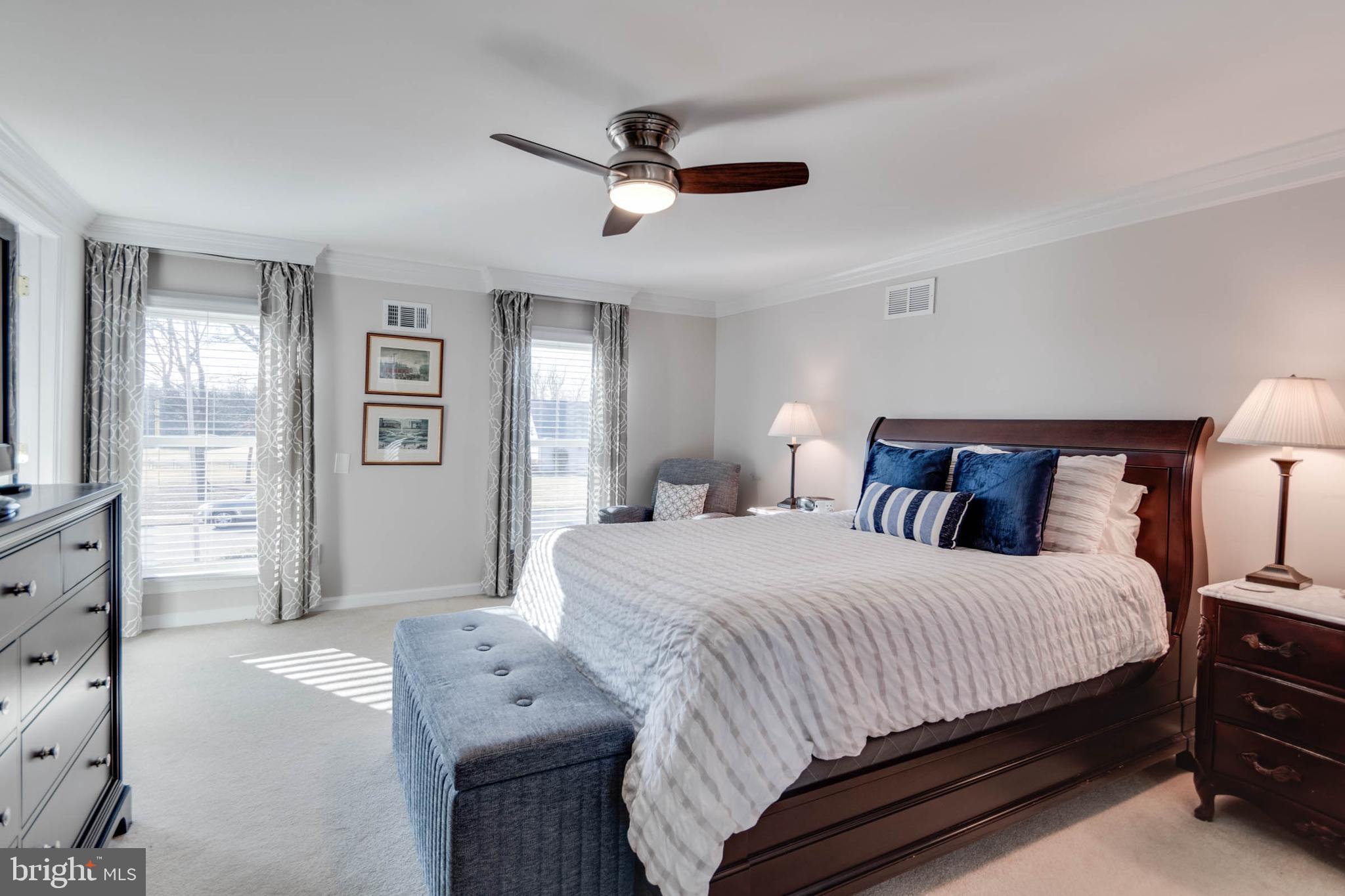 1007 St Stephens Road Alexandria, VA 22304 - Photo 33 of 59 a bedroom with a bed and wooden floor