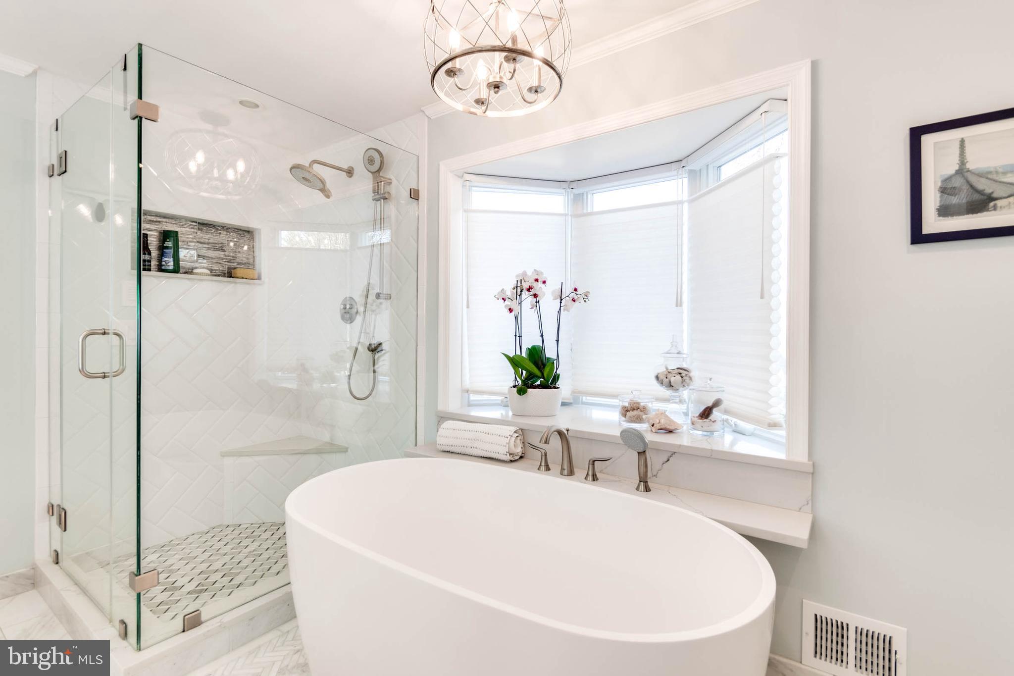 1007 St Stephens Road Alexandria, VA 22304 - Photo 38 of 59 a white bath tub sitting next to a bathroom