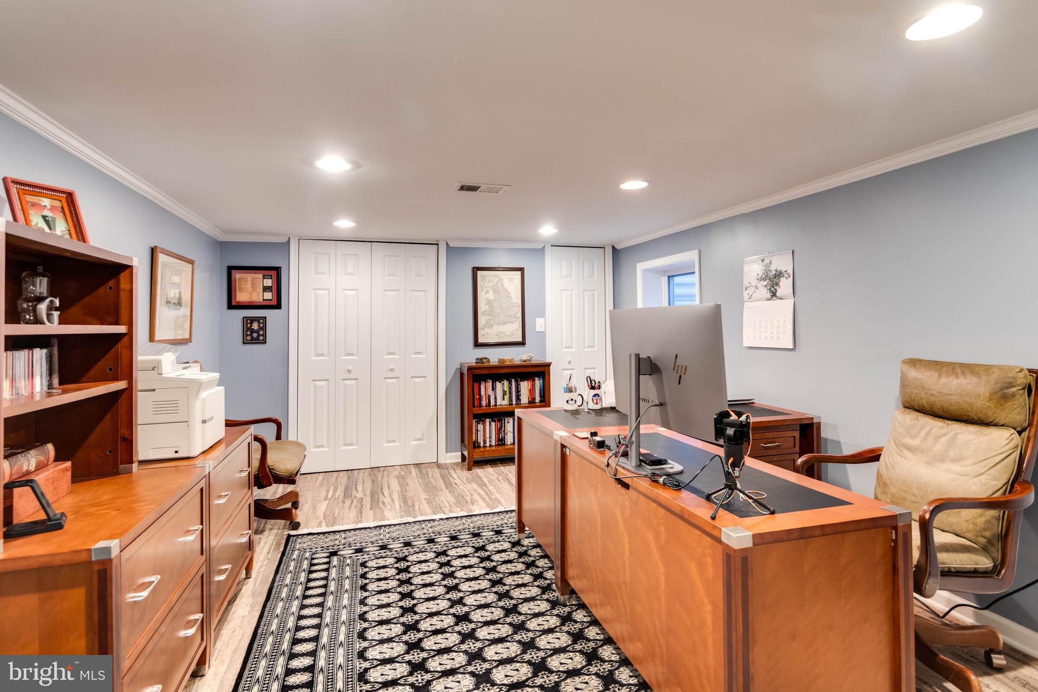 1007 St Stephens Road Alexandria, VA 22304 - Photo 55 of 59 a room with furniture a rug and a book shelf