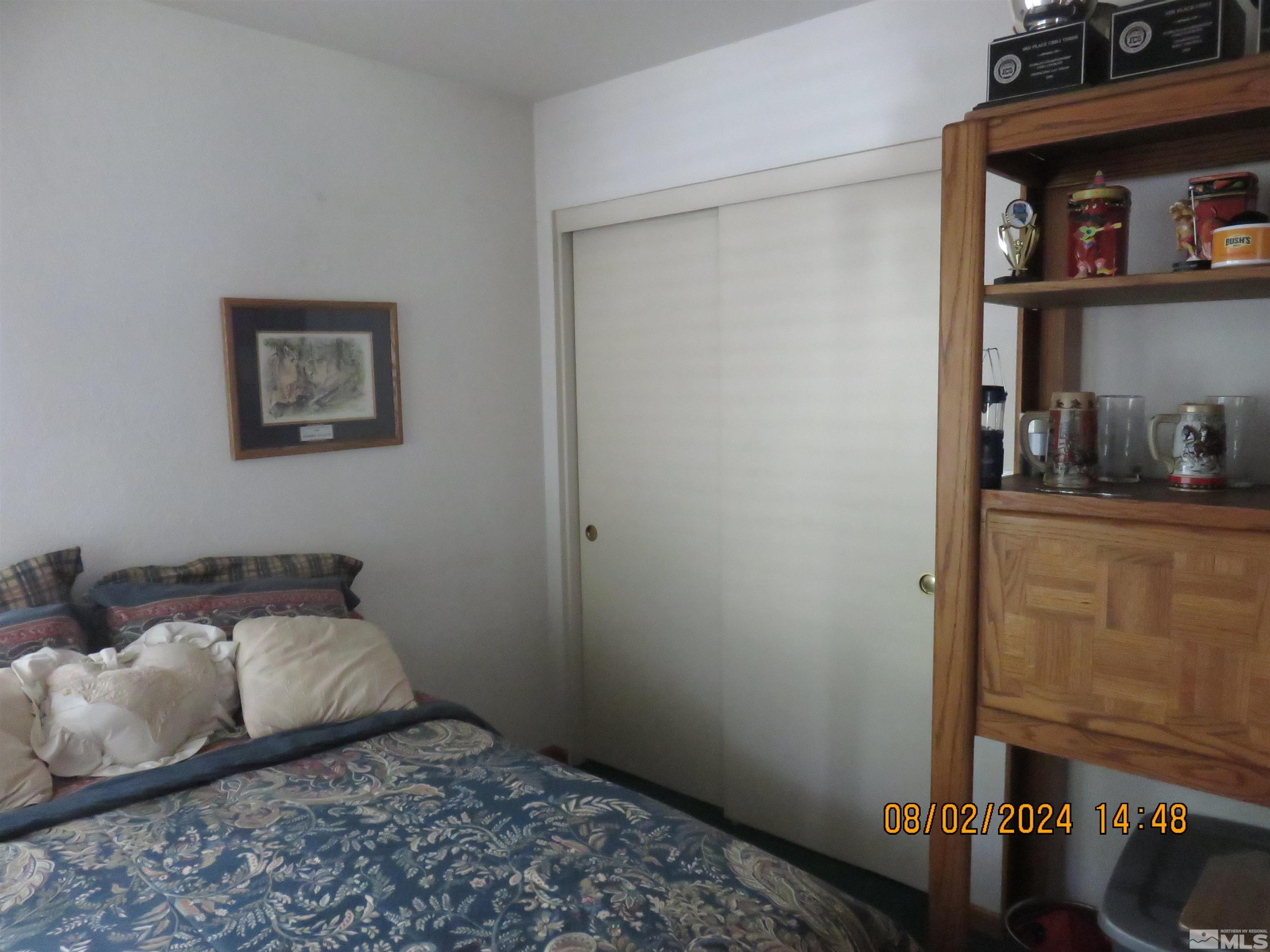 7131 Lighthouse Lane Reno, NV 89511 - Photo 5 of 11 a bedroom with a bed and closet