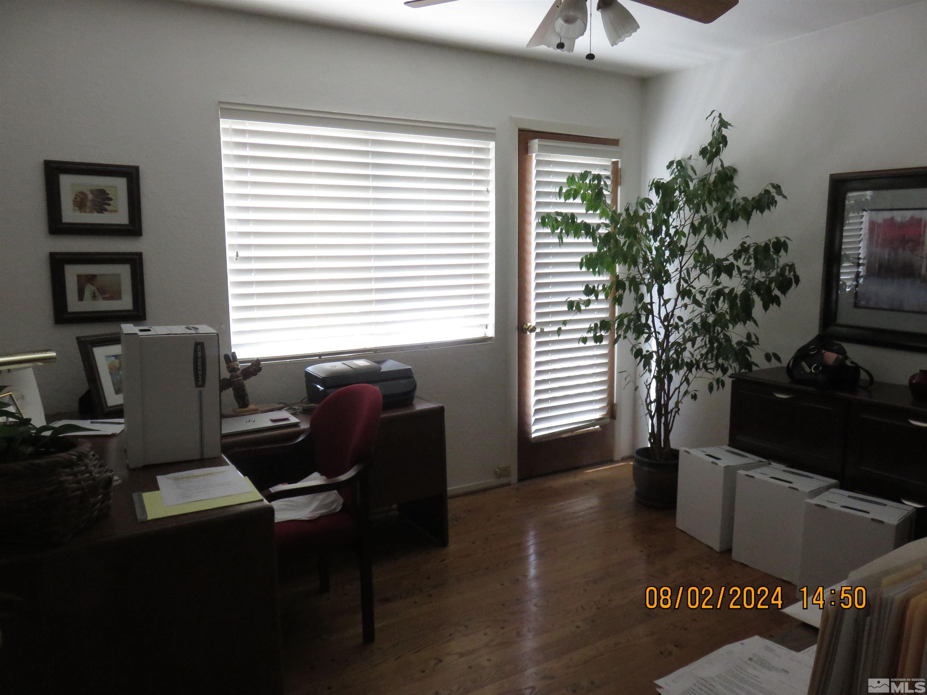 7131 Lighthouse Lane Reno, NV 89511 - Photo 8 of 11 a view of a workspace with furniture and a window