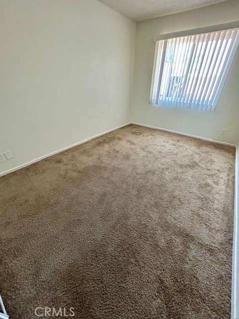 68460 Kings Road, Unit C Cathedral City, CA 92234 - Photo 16 of 18 an empty room with windows