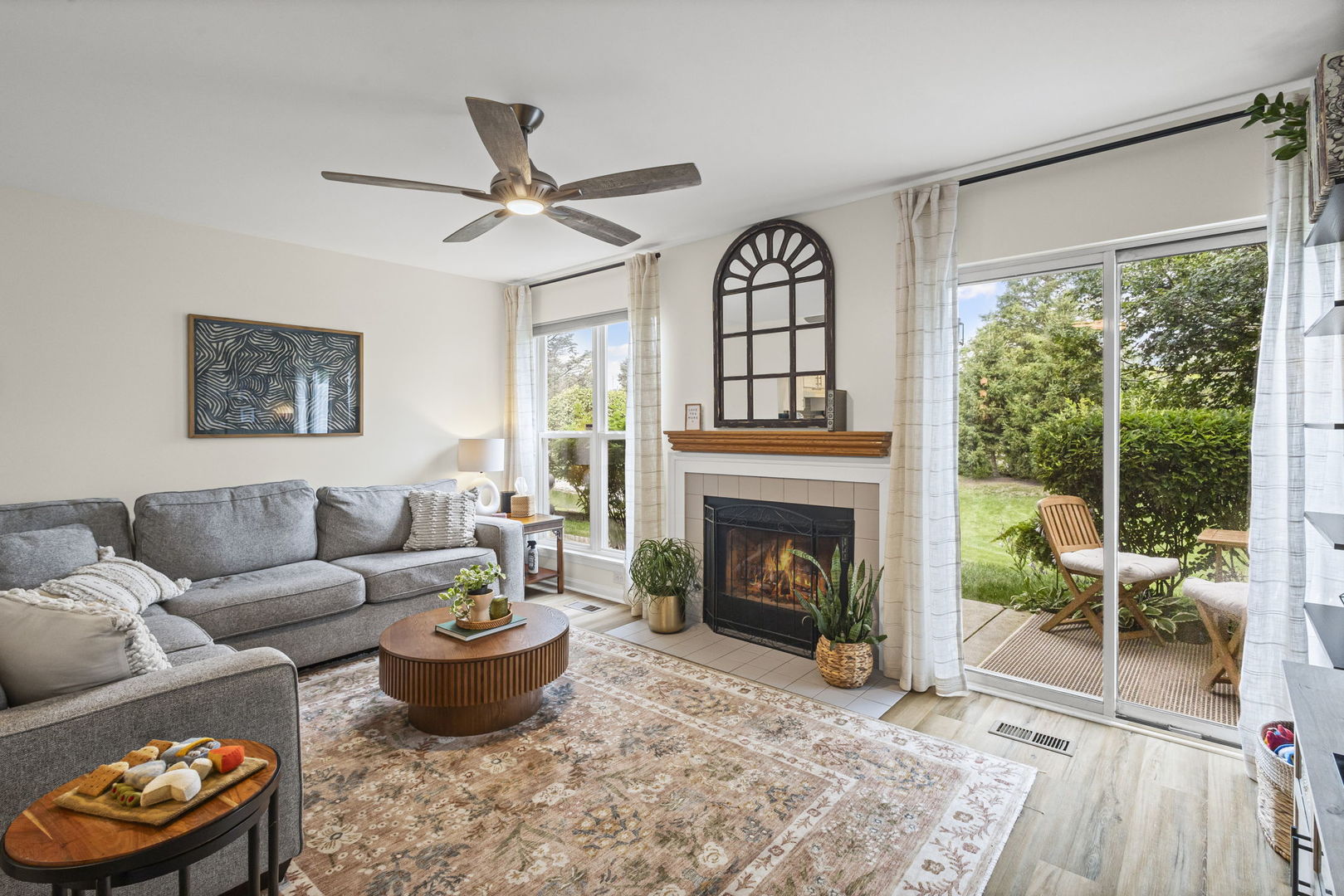 111 Cathy Lane Mount Prospect, IL 60056 - Photo 11 of 36 a living room with furniture and a fireplace