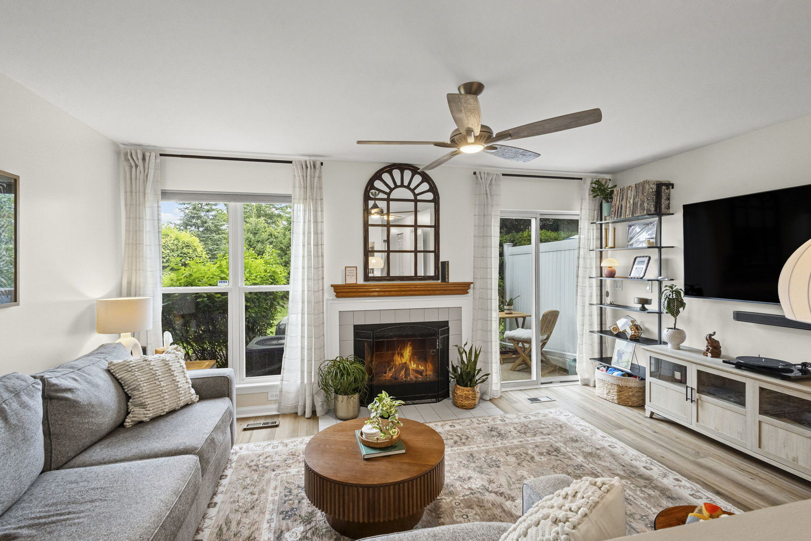 111 Cathy Lane Mount Prospect, IL 60056 - Photo 15 of 36 a living room with furniture a fireplace and a flat screen tv