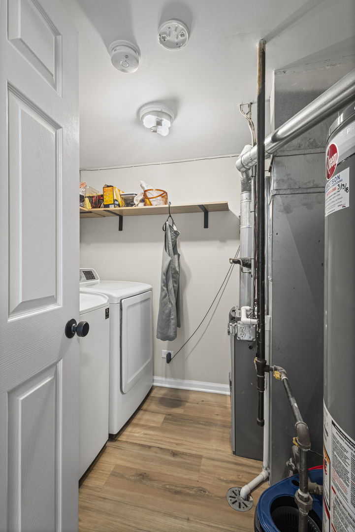 111 Cathy Lane Mount Prospect, IL 60056 - Photo 17 of 36 a view of storage and utility room with a washer and dryer
